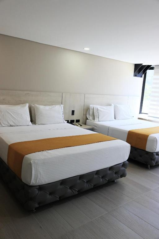 Postel nebo postele na pokoji v ubytování Hotel Loup