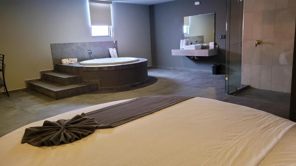 Postel nebo postele na pokoji v ubytování 4Play Motel