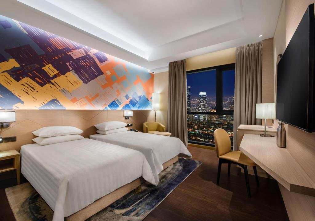 Postel nebo postele na pokoji v ubytování Sunway Hotel Big Box