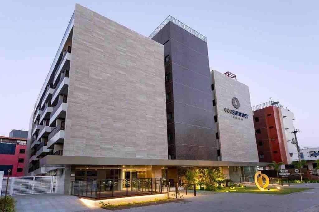 a large building with a sign in front of it at Eco Summer Tambaú, LikeHome in Tambaú