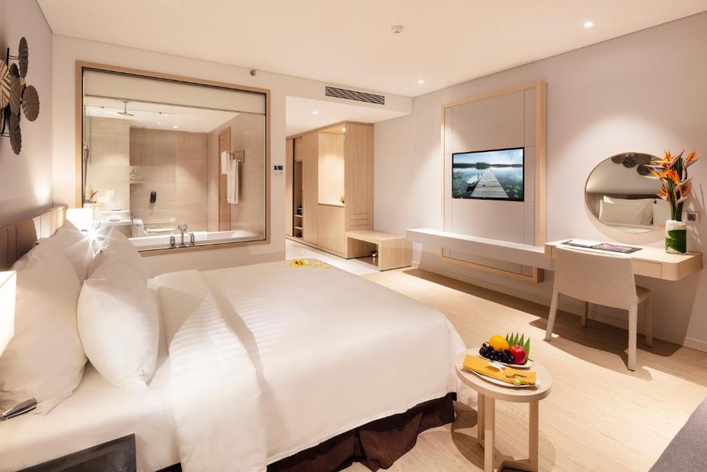 Postel nebo postele na pokoji v ubytování DQua Hotel