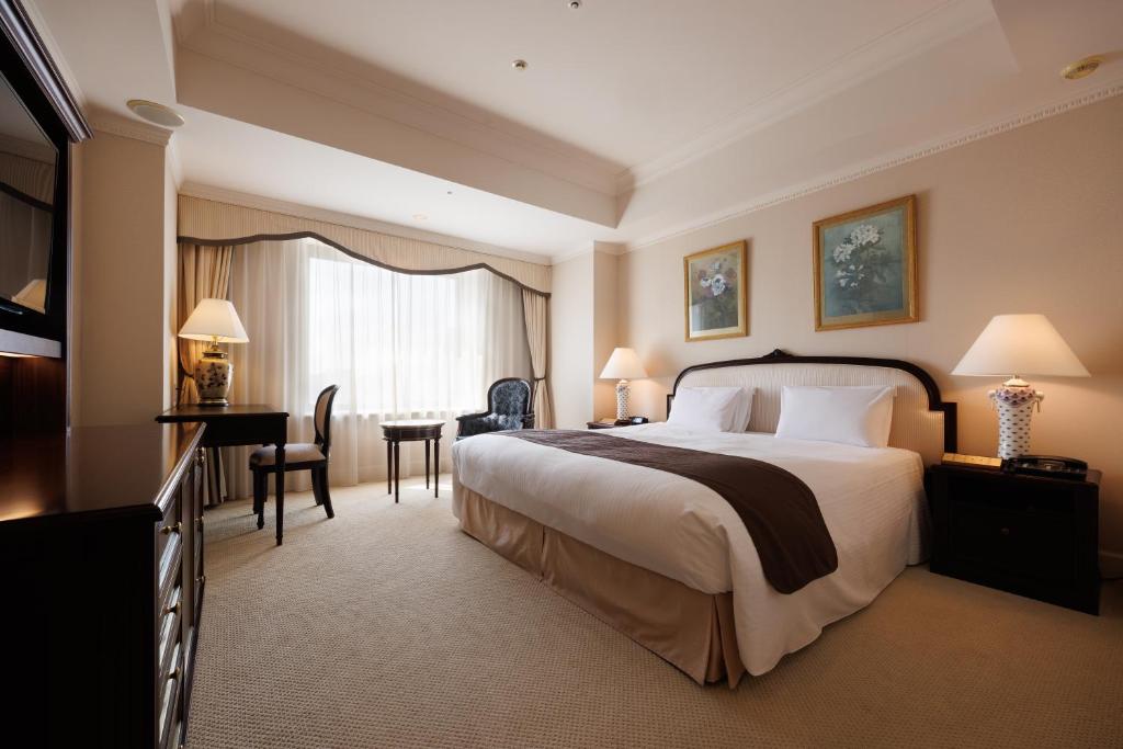 Cama ou camas em um quarto em Dai-ichi Hotel Tokyo