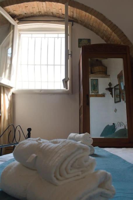 Postel nebo postele na pokoji v ubytování La Piccola Bellezza