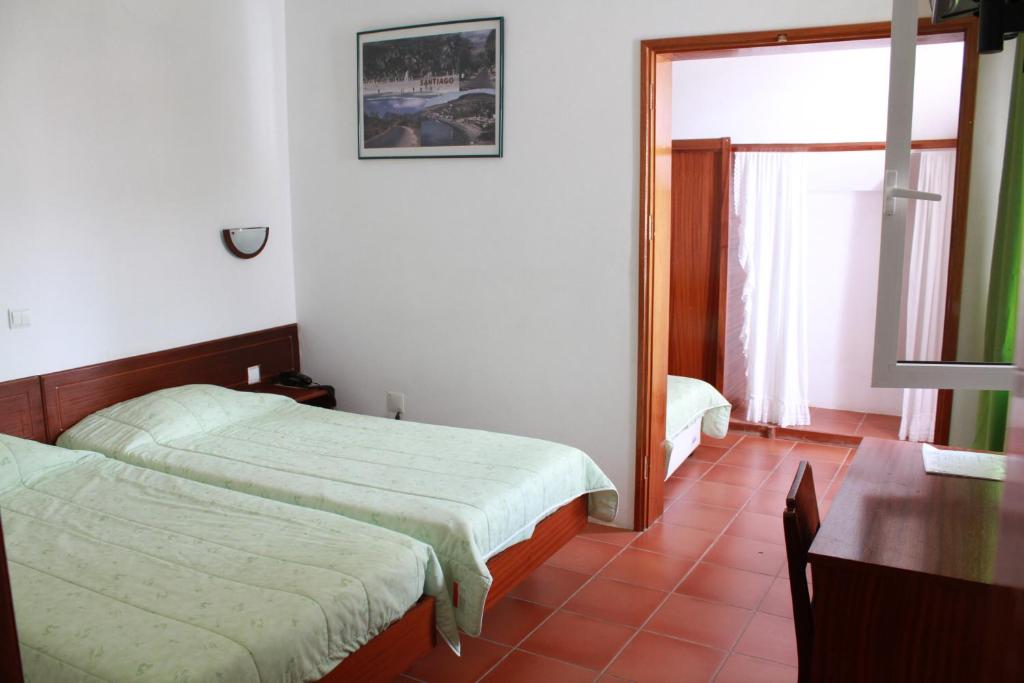 Postel nebo postele na pokoji v ubytování Residencial Che Guevara Bed & Breakfast