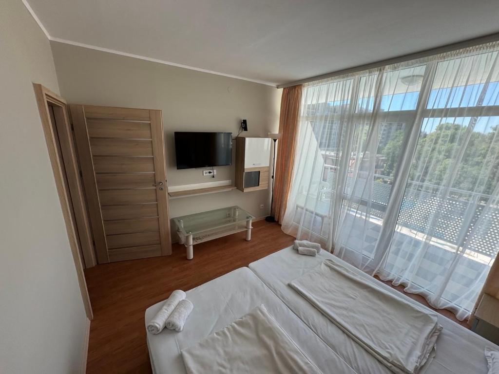 TV a/nebo společenská místnost v ubytování Oasis-Apartament