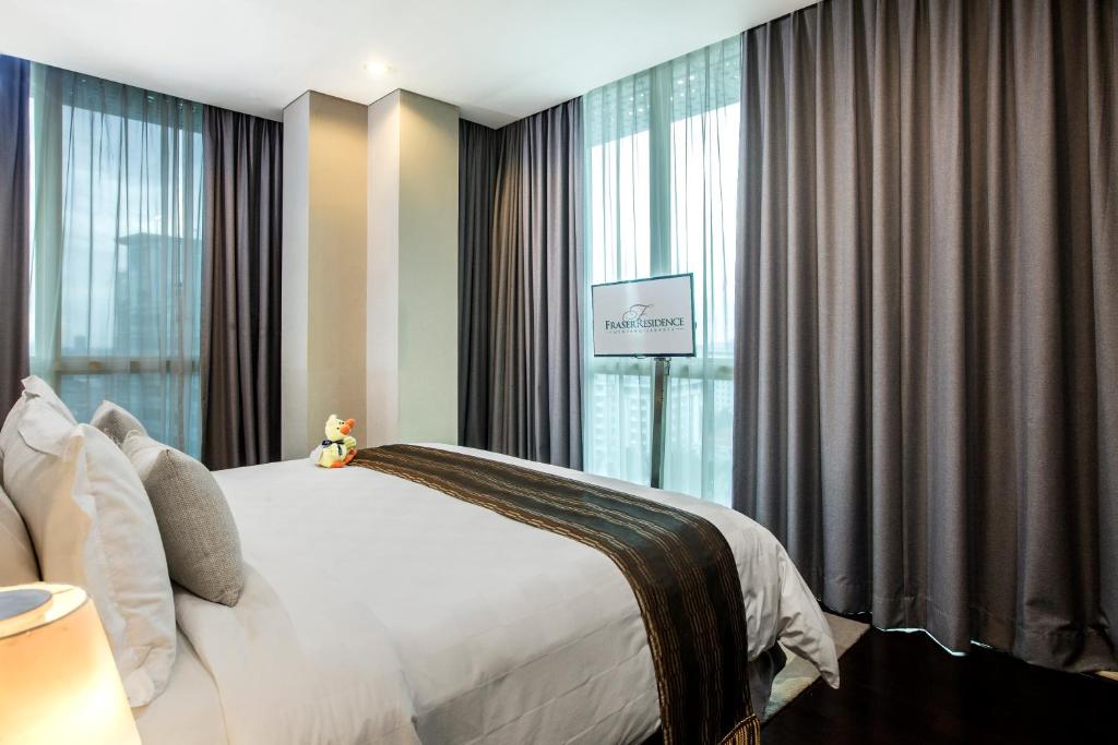 Postel nebo postele na pokoji v ubytování Fraser Residence Menteng Jakarta