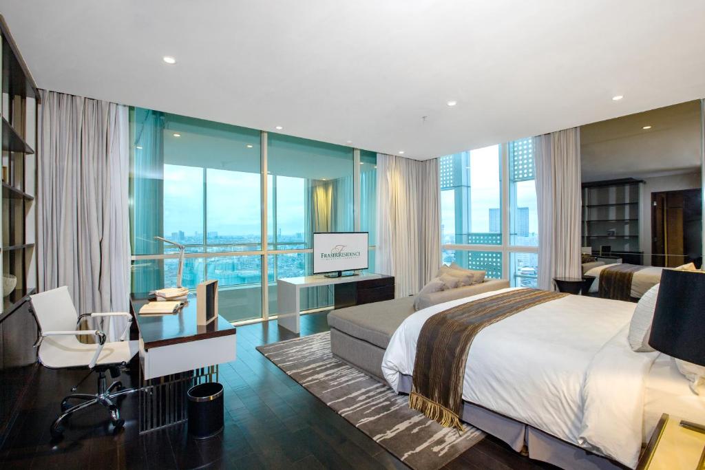 Postel nebo postele na pokoji v ubytování Fraser Residence Menteng Jakarta