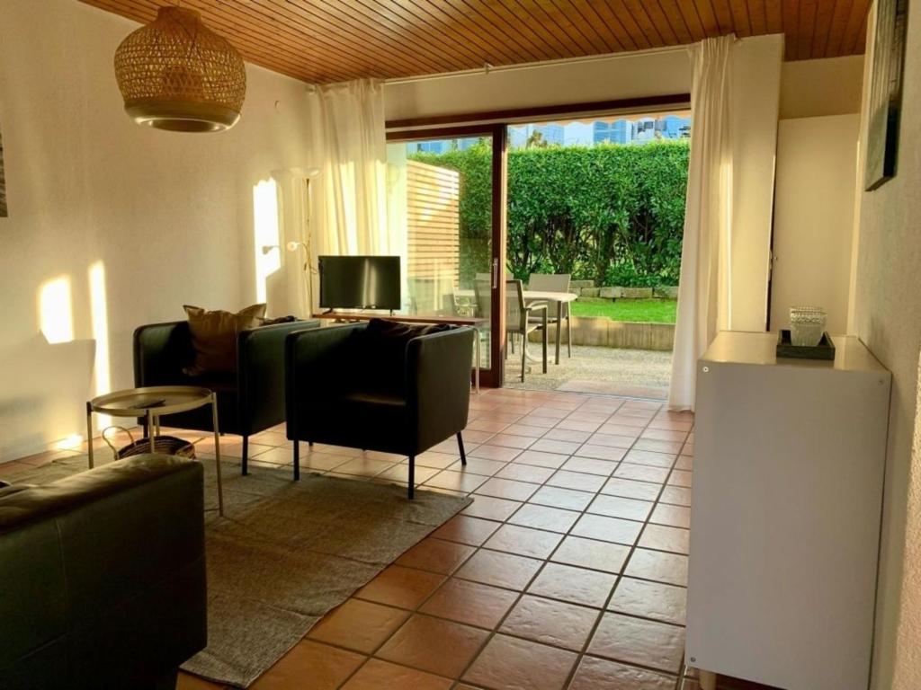 a living room with a couch and a table at Haus Elstar in Bodman-Ludwigshafen