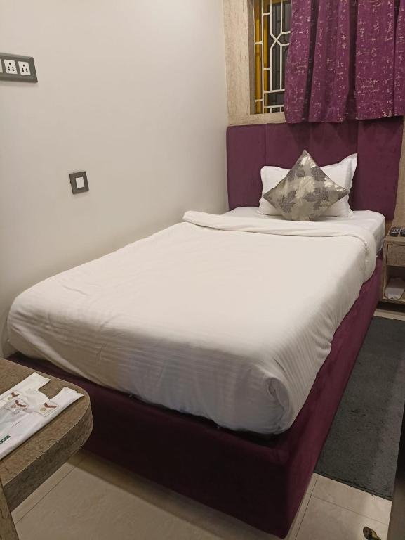 Postel nebo postele na pokoji v ubytování karisma premium
