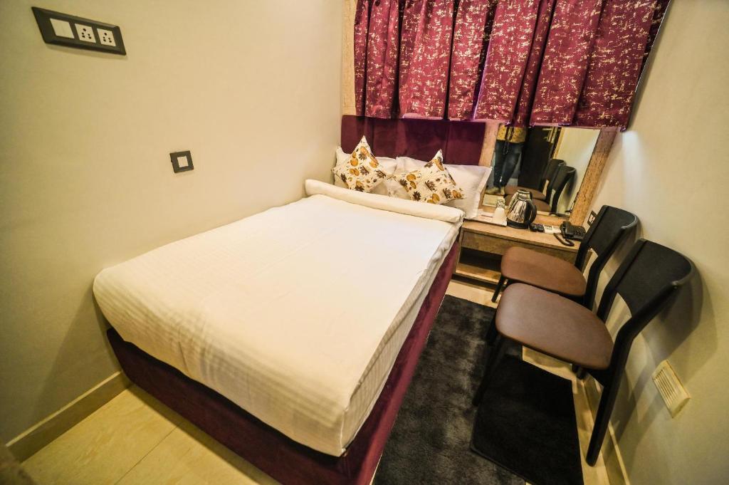 Postel nebo postele na pokoji v ubytování karisma premium