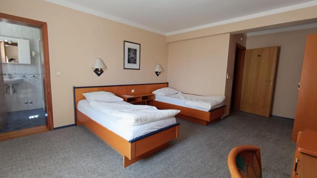 Postel nebo postele na pokoji v ubytování Hotel Delminium