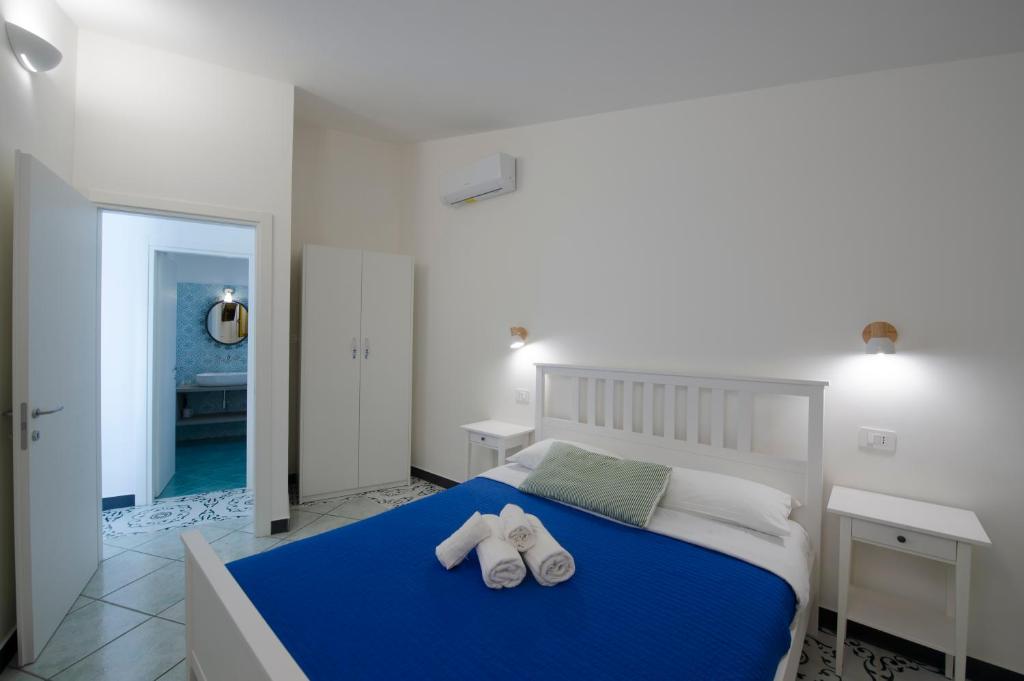Кровать или кровати в номере Terrazza sul mare