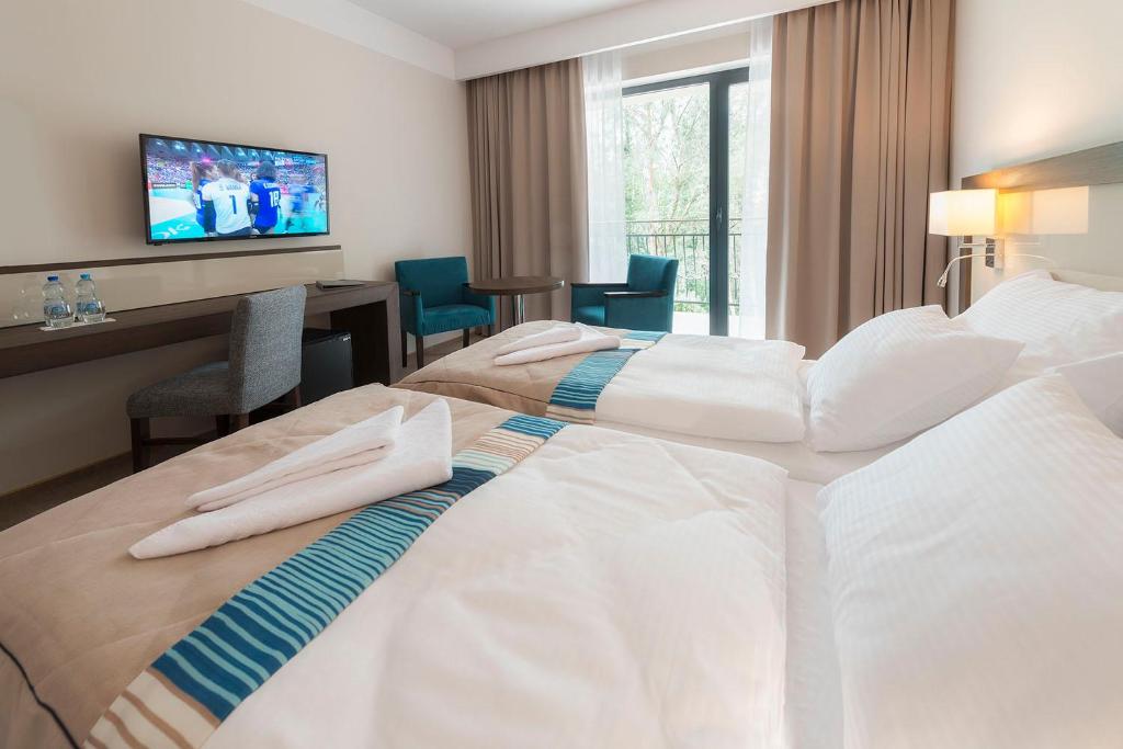 Postel nebo postele na pokoji v ubytování Hotel Ewerdin