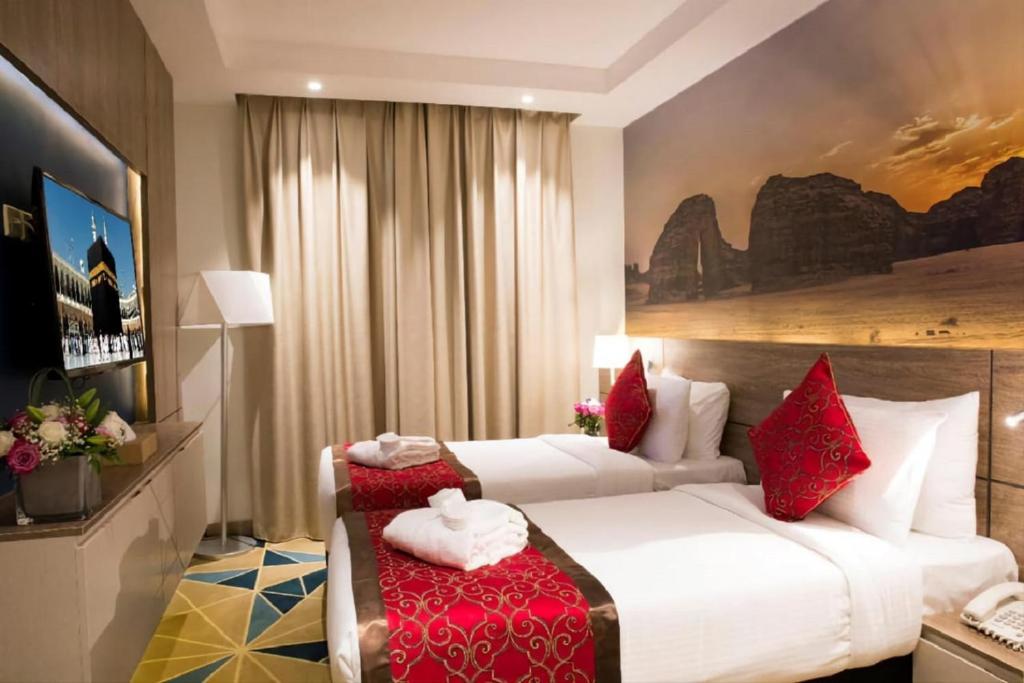 TV a/nebo společenská místnost v ubytování Hibatullah Hotel Makkah