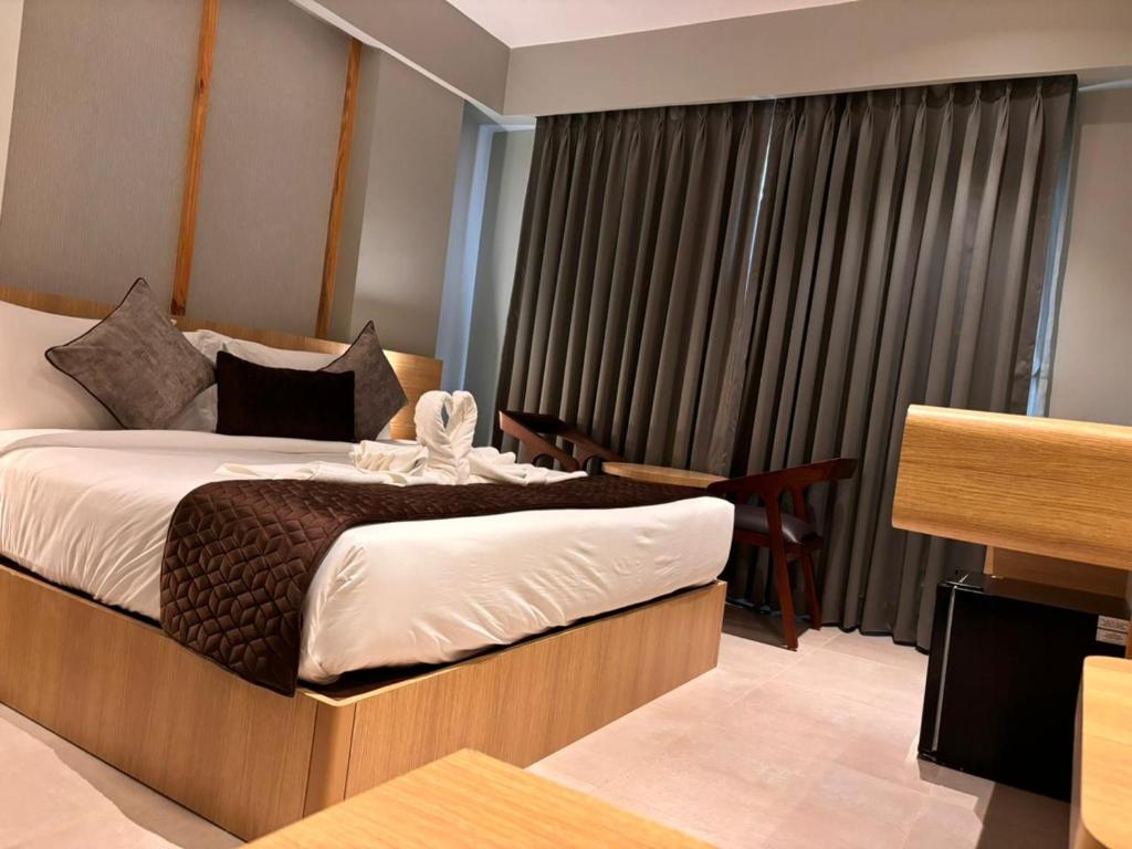 Postel nebo postele na pokoji v ubytování Northin Hotel