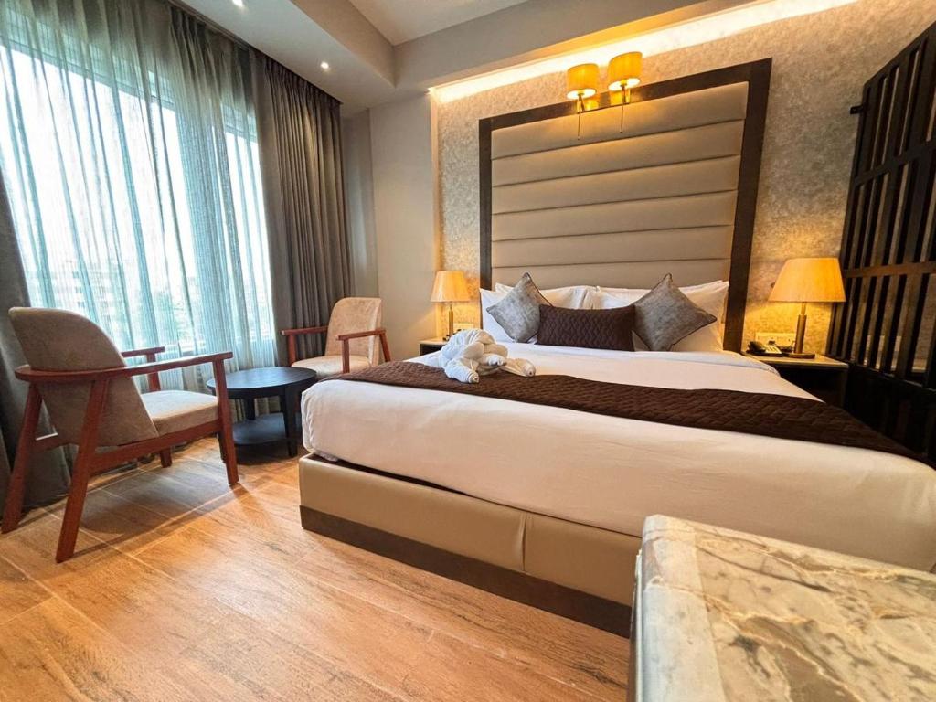 Postel nebo postele na pokoji v ubytování Northin Hotel