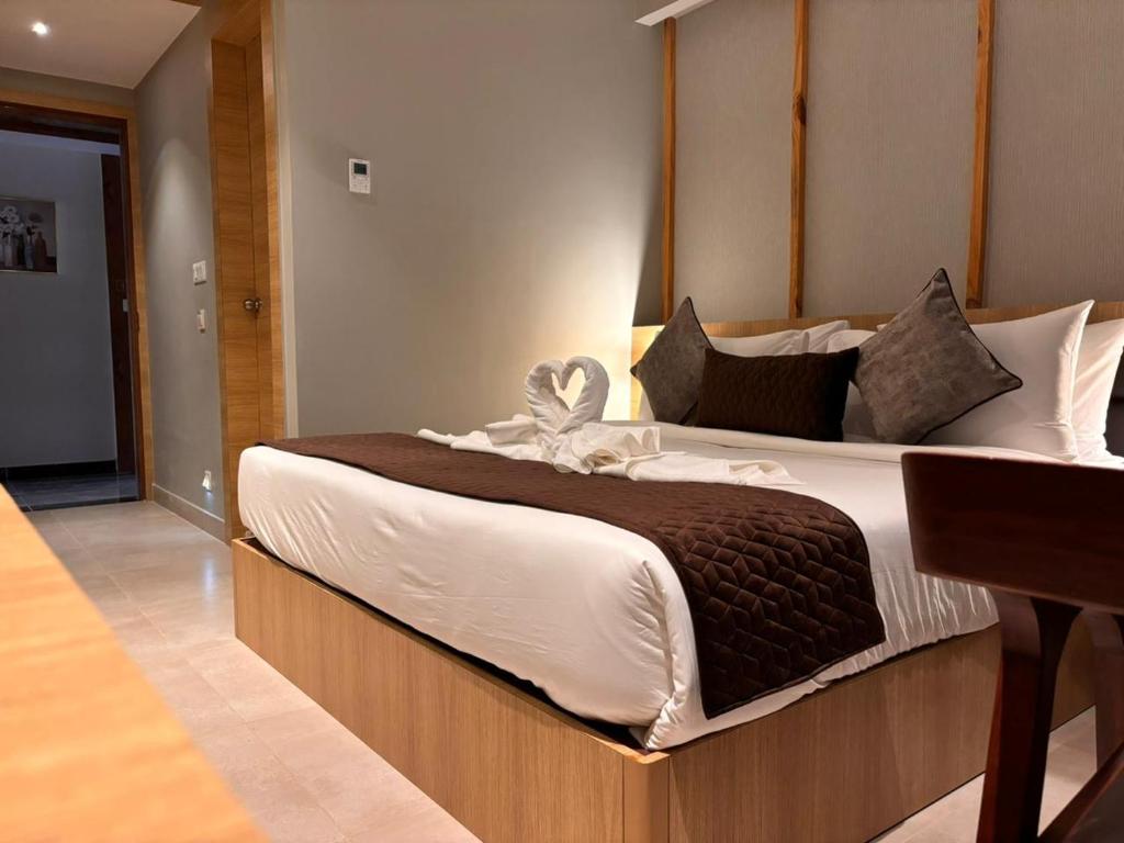 Postel nebo postele na pokoji v ubytování Northin Hotel