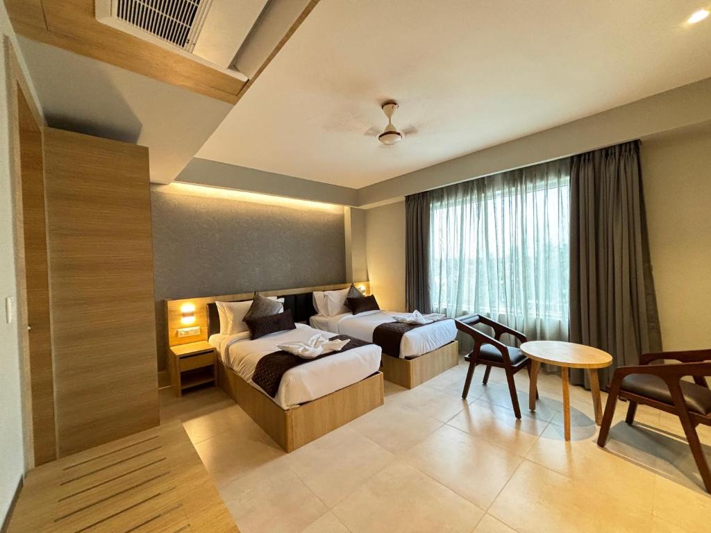 Postel nebo postele na pokoji v ubytování Northin Hotel