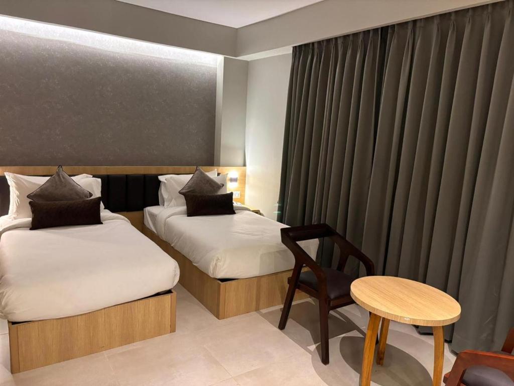 Postel nebo postele na pokoji v ubytování Northin Hotel