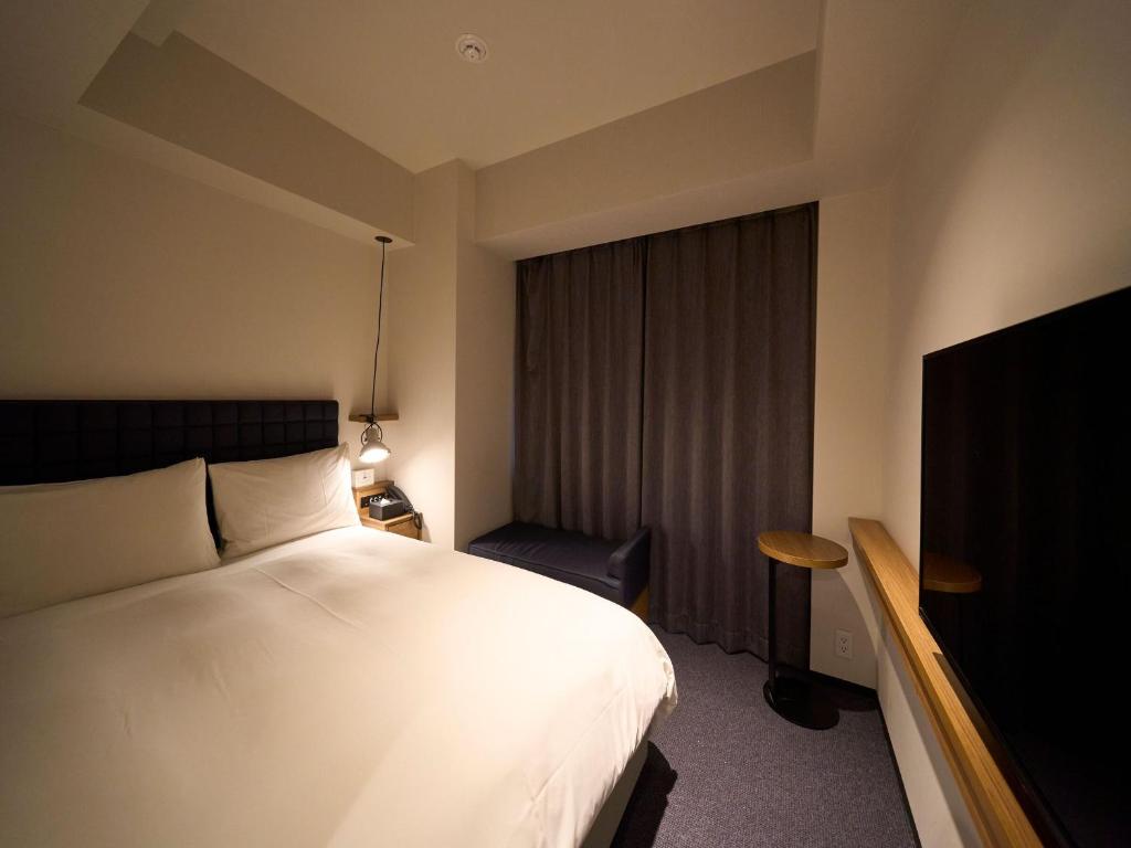 Postel nebo postele na pokoji v ubytování Hotel Resol Stay Akihabara