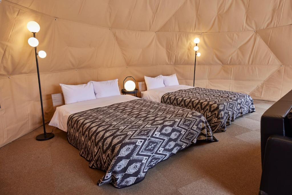 Postel nebo postele na pokoji v ubytování Resoreat高島 Glamping