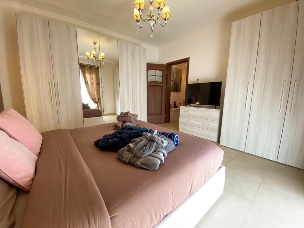 Postel nebo postele na pokoji v ubytování KIMRAY Boutique Apartment - Indulge in Comfort, Embrace Tranquility
