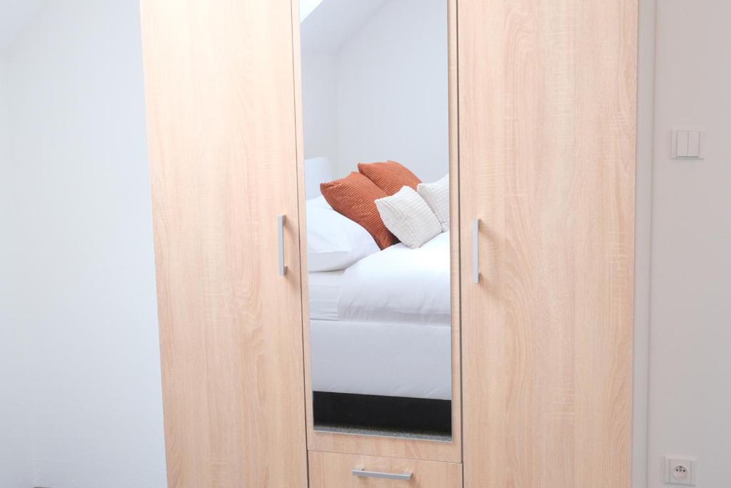 Postel nebo postele na pokoji v ubytování Apartmány Na Kovárně Rájov