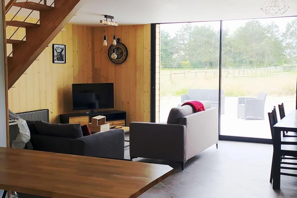 TV a/nebo společenská místnost v ubytování Le gîte de la Ferme