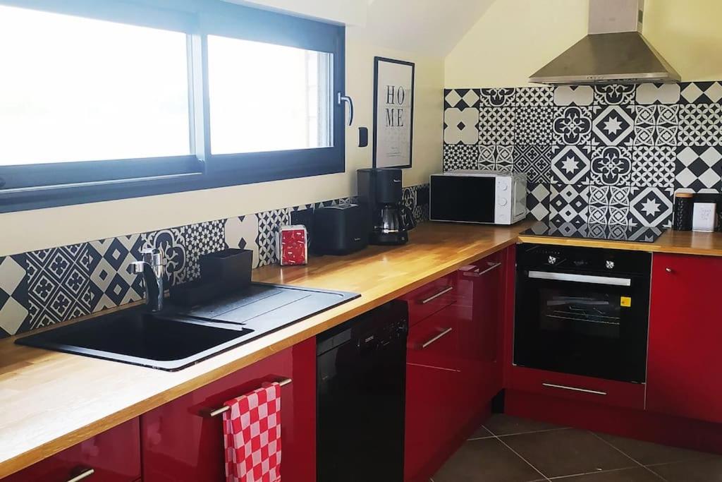 Kuchyň nebo kuchyňský kout v ubytování Le gîte de la Ferme
