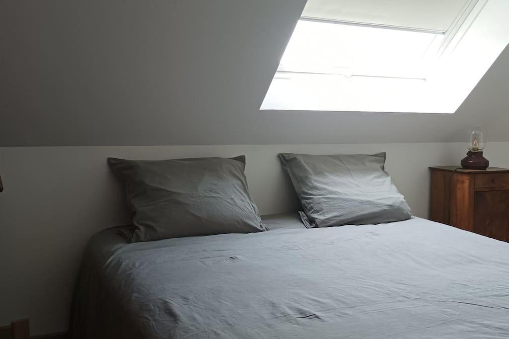 Postel nebo postele na pokoji v ubytování Le gîte de la Ferme