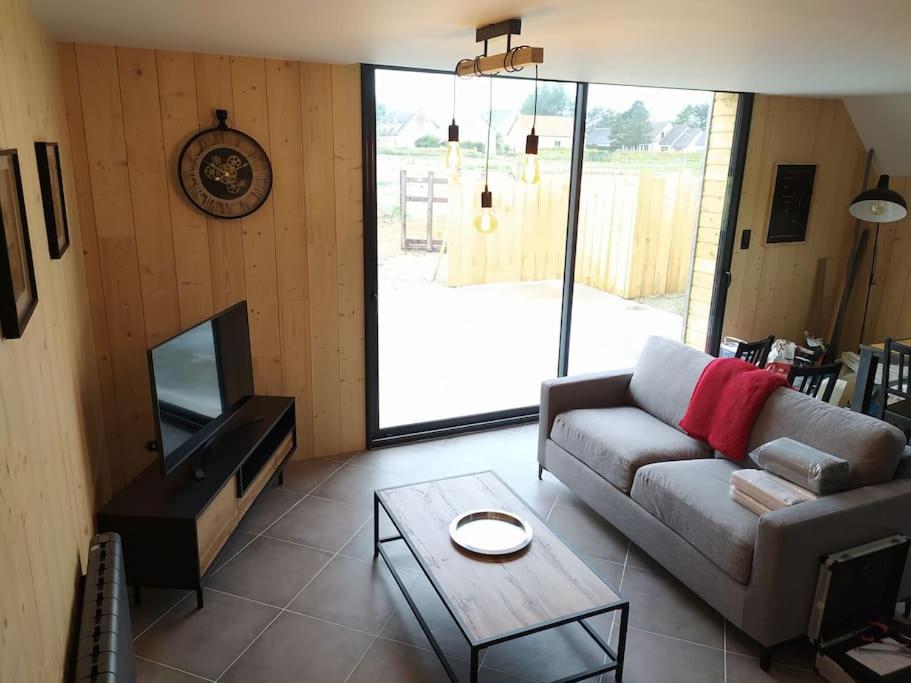TV a/nebo společenská místnost v ubytování Le gîte de la Ferme