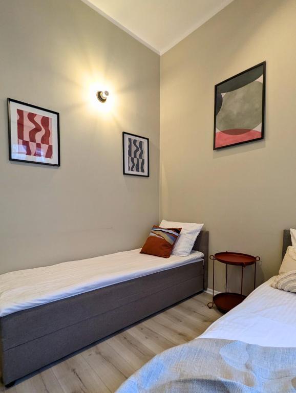 Voodi või voodid majutusasutuse RYNEK 30 Hostel toas