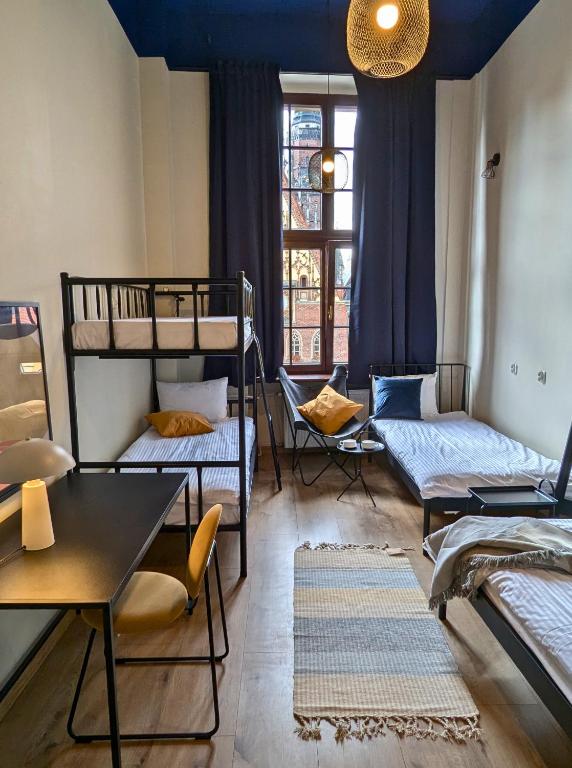 Voodi või voodid majutusasutuse RYNEK 30 Hostel toas