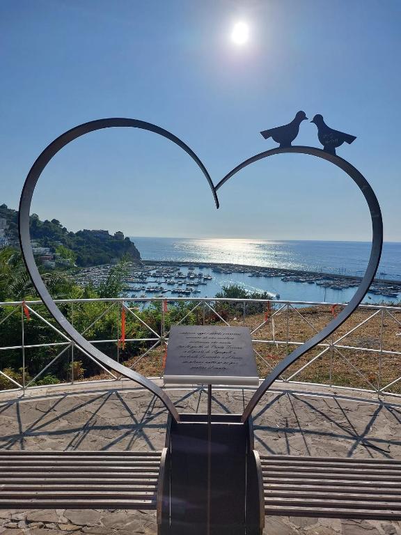 a sculpture of two hearts with a view of the ocean at Casa Vacanze RosMary in Agropoli