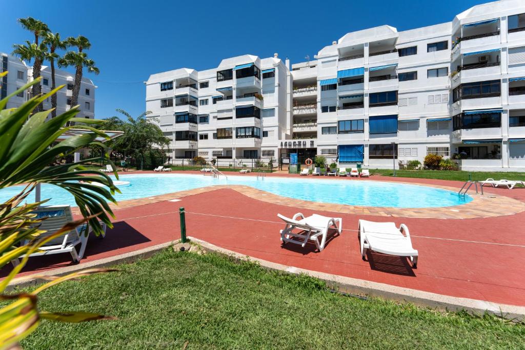 Der Swimmingpool an oder in der Nähe von Garden View Apartment Iguazu 3 near Yumbo