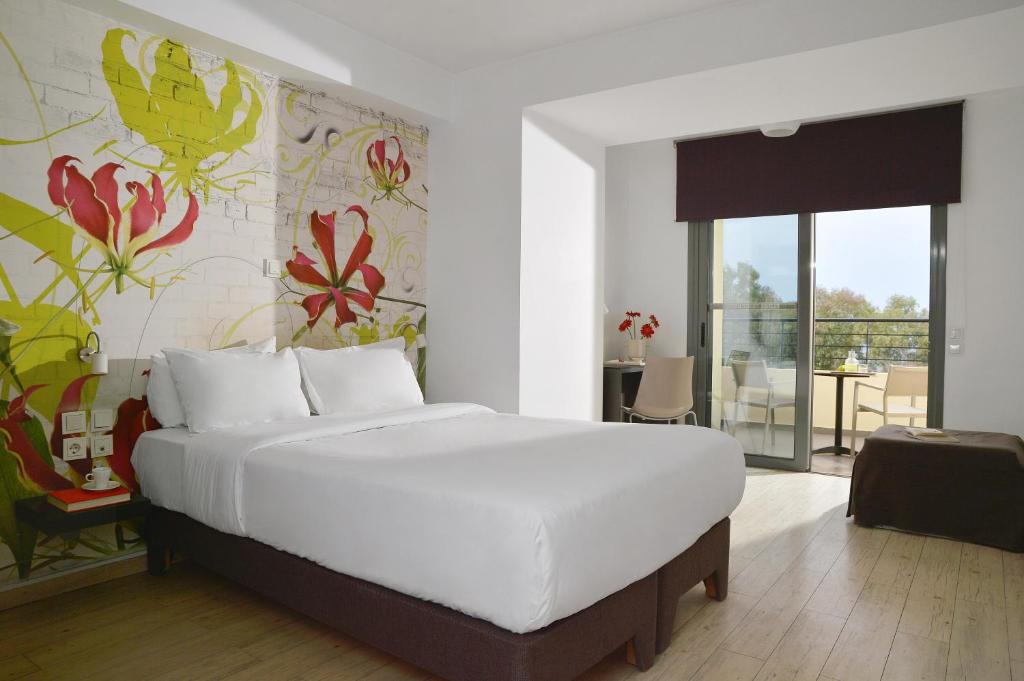 Postel nebo postele na pokoji v ubytování Airotel Patras Smart Hotel