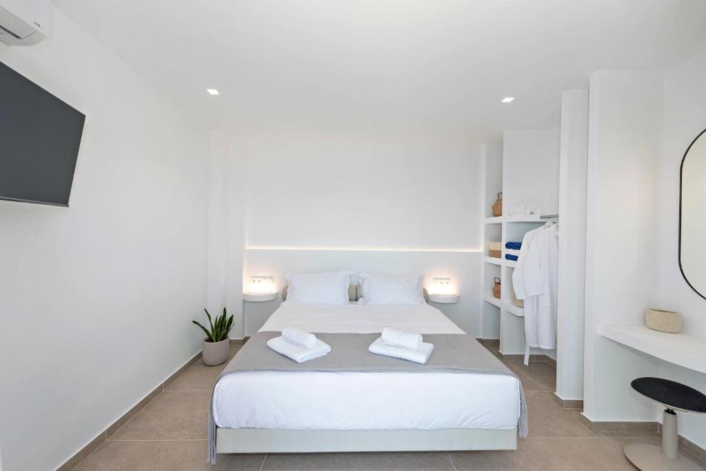 Ένα ή περισσότερα κρεβάτια σε δωμάτιο στο Nissaki Villas