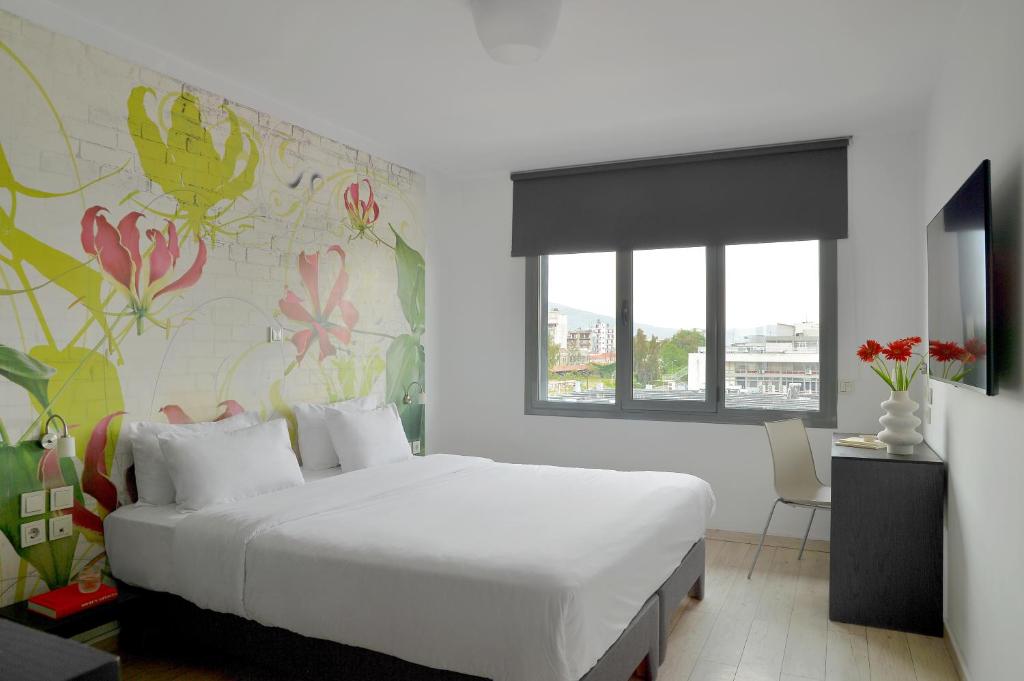 Postel nebo postele na pokoji v ubytování Airotel Patras Smart Hotel