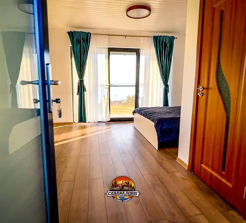 Postel nebo postele na pokoji v ubytování Cabana Doris Coronini