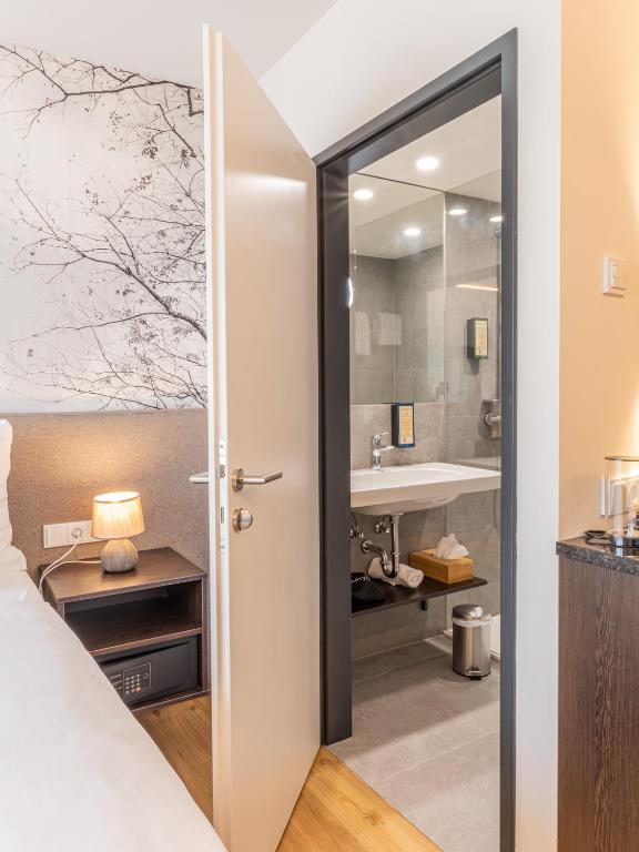 Koupelna v ubytování Hotel DAS SAAL