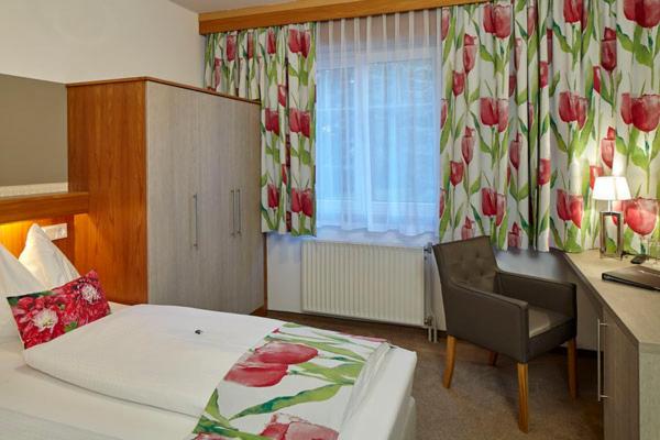 Postel nebo postele na pokoji v ubytování Pension Haus Aschgan
