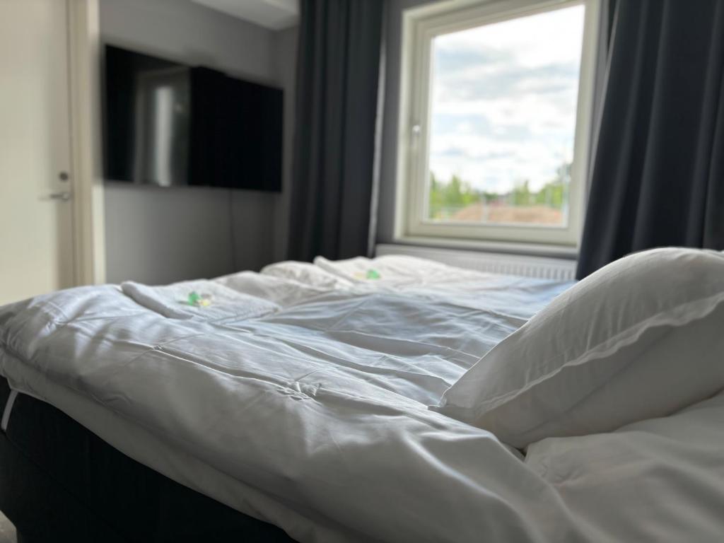 Postel nebo postele na pokoji v ubytování Hotel Lapland River