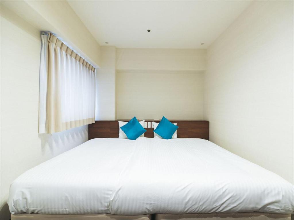 Postel nebo postele na pokoji v ubytování Cityroute Hotel
