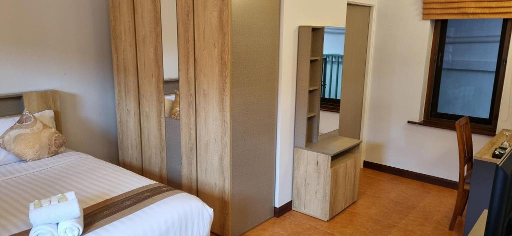 Postel nebo postele na pokoji v ubytování Meyers Hua Hin