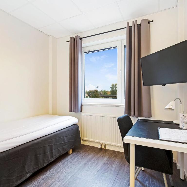 Postel nebo postele na pokoji v ubytování Centralhotellet