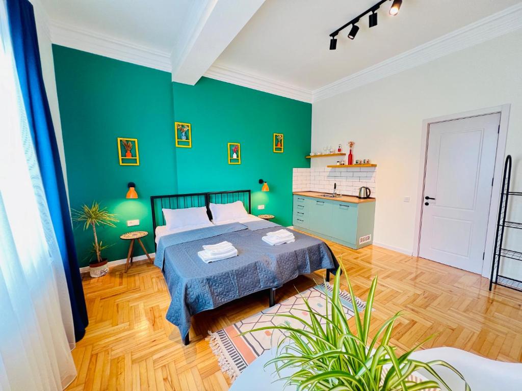 Letto o letti in una camera di Pirosmani Boutique Aparthotel