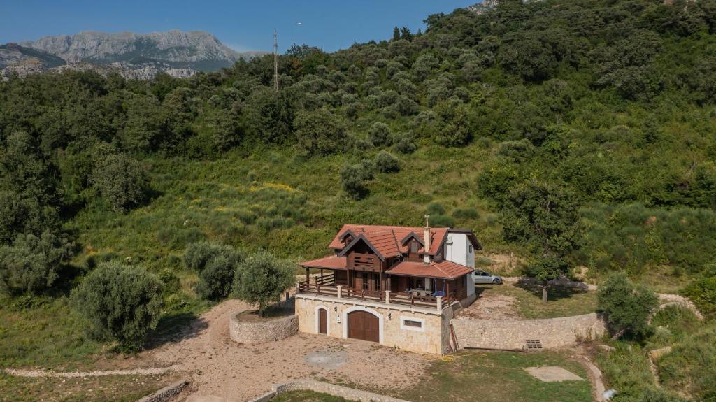 an aerial view of a house on a hill at Panora Oliva in Rap
