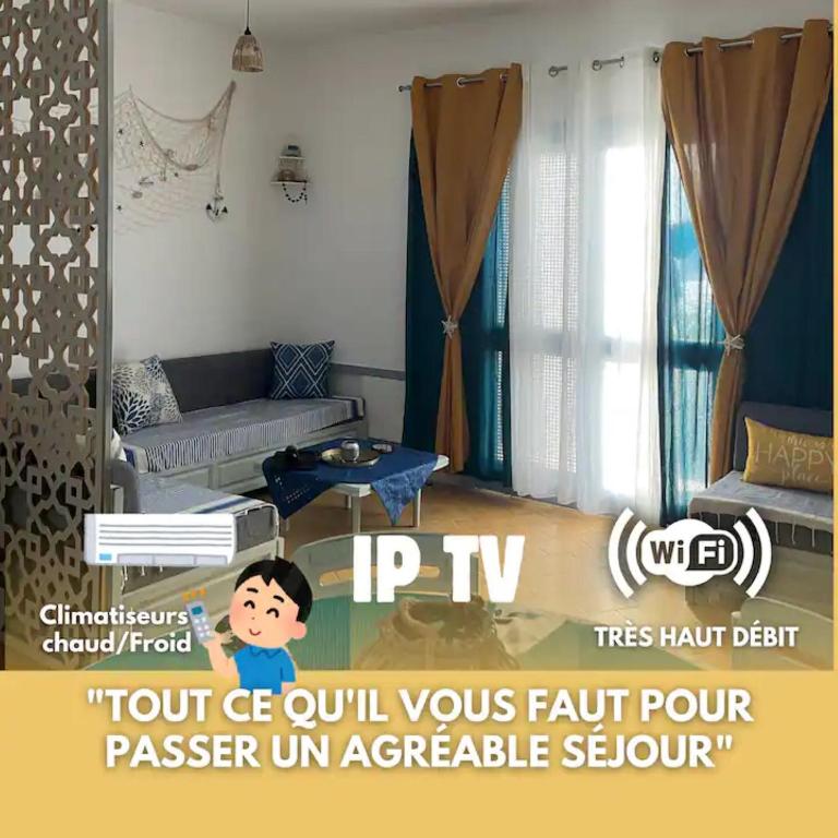 a boy is standing in a living room at Velazzura Marina- Duplex à Monastir in Monastir