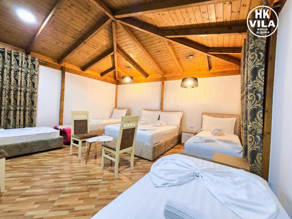 Postel nebo postele na pokoji v ubytování Vila HK
