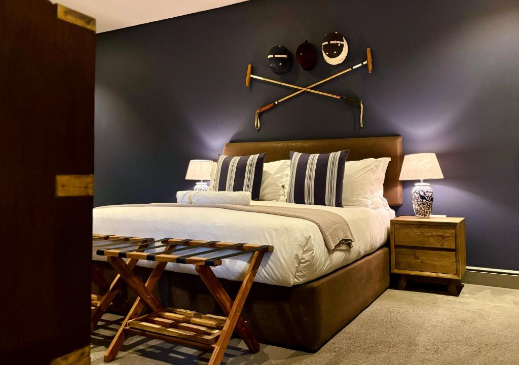 a bedroom with a bed with baseball equipment on the wall at Blix Inn Guesthouse in Stellenbosch